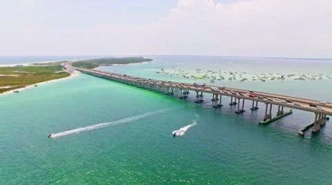Ocean waterfront by shallow lagoon surrounded by beaches Stock-Footage 54944521