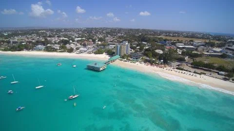 Ocean waters along a tropical Beach featuring boats and Yachts Stock Photos