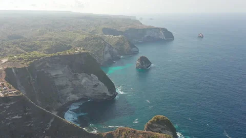 Ocean Waters and Tall Cliffs Along Manta Bay, Indonesia Stock Footage 133830036