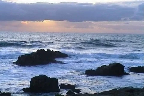Ocean wave against rocks Stock Footage 111172