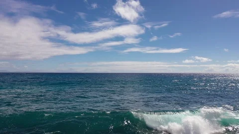 Ocean wave with blue sky 4K Stock Footage 107398437