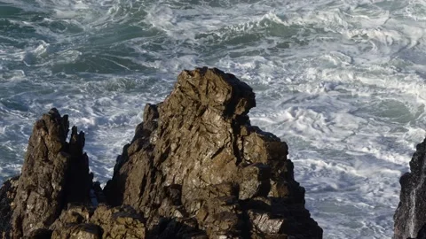 Ocean Wave Breaking onto Rocks Stock Footage 204899412