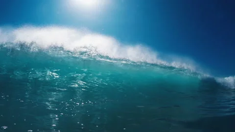 Ocean wave breaks with splashes on the camera Stock Footage 168612486