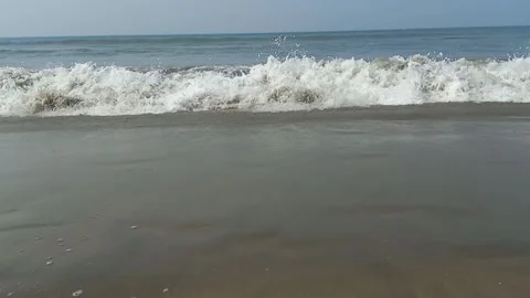 Ocean wave breaks with spray Video stock 274557692