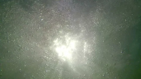 Ocean wave breaks under sun light Stock Footage 66255740