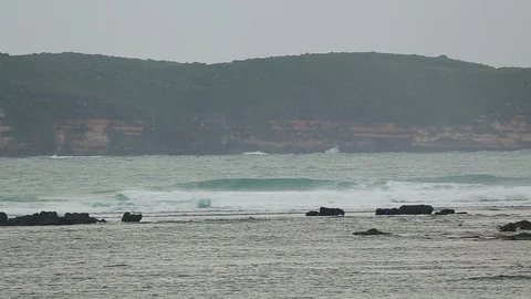 Ocean wave on a cloudy day on a cliff background Stock Footage 102565671