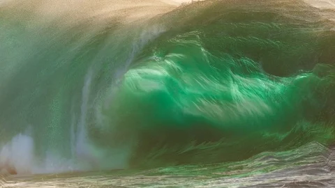 Ocean wave crashing on beach in dramatic cinemagraph Stock Footage 82247491