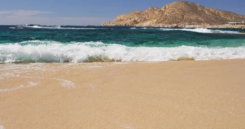 Ocean wave crashing on a white sandy beach Stock Footage 101215276