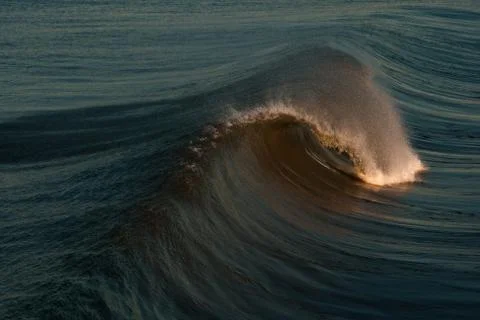 Ocean Wave Curling Sunset Stock Photos