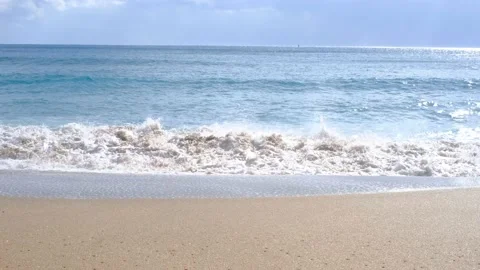 A ocean wave with foam and sandy shore, summer background. Stock Footage 231961330