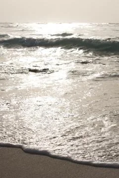 Ocean wave getting to the beach Stock Photos
