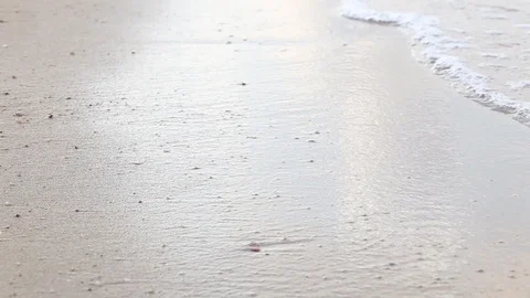 Ocean wave hit the beach,Sea waves with wave crashing on sandy shore  Stock Footage 111276407