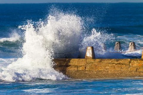 Ocean Wave Hitting Tidal Pool Stock Photos