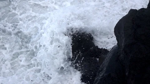 Ocean wave over rock slow motion Stock Footage 103988078