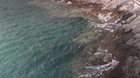 Ocean wave over rocks Stock Footage 234307766