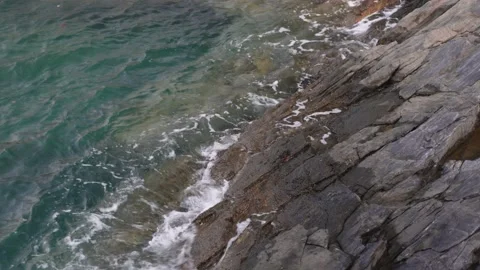 Ocean wave over rocks Video stock 234307884