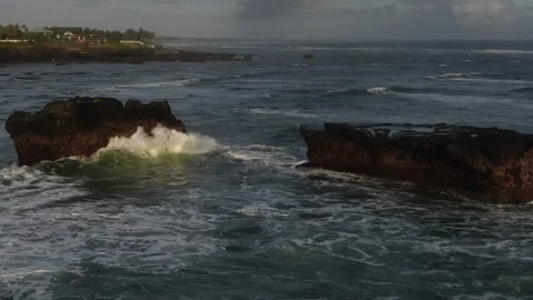 Ocean wave rocks cinematic drone bali Stock Footage 303629900
