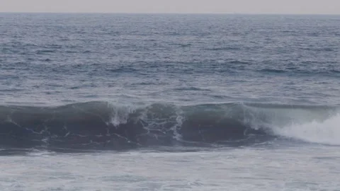 Ocean wave rolling and crashing in slow motion at the beach Video stock 341112268