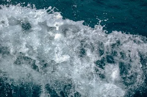 Ocean Wave Splashing in Deep Blue Water Stock Photos