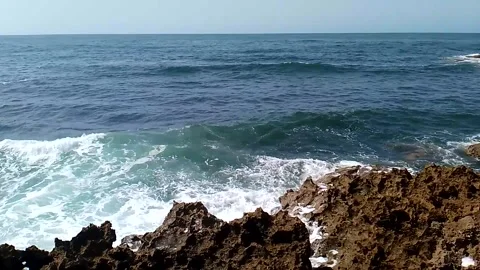 Ocean Wave Splashing White Water and Spray Over Sharp Coastal Reef Stock Footage 342612601