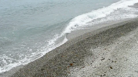 Ocean wave, stone beach closeup, ecological environment, vacations. Video stock 25286396