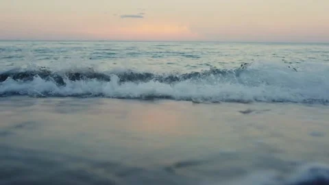 Ocean wave at sunset beach. Stock Footage 306285894