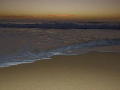 OCEAN WAVE AT SUNSET Stock Photos