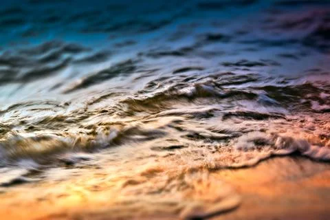 Ocean wave in sunset time Stock Photos