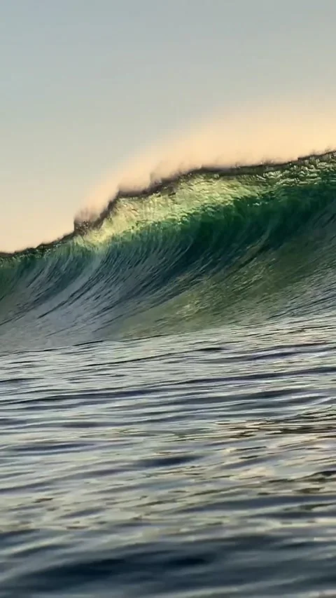 Ocean wave at sunset time.Vertial video Stock Footage 296166829