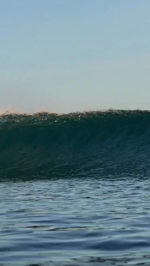 Ocean wave at sunset time.Vertial video Stock Footage 296166840