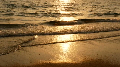 Ocean wave on tropical beach at sunset time , sunlight reflect on water surface. Stock-Footage 238449397