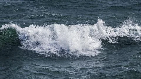 Ocean wave water splashes close up 库存照片