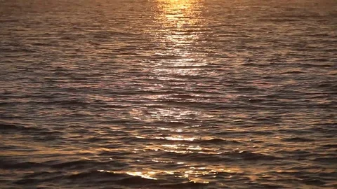 Ocean wave water surface with rising sun reflection Stock Footage 78420168