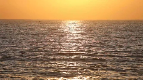 Ocean wave water surface with rising sun reflection Stock Footage 78420203