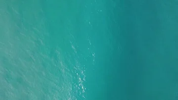 Ocean Waves From Above Arriving to Shallow Waters 4K Great for Titles Stock Footage 86015353