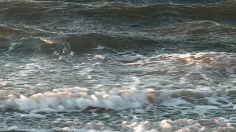 Ocean Waves Actively Crashing at Sunset in Close-Up Stock Footage 185095836