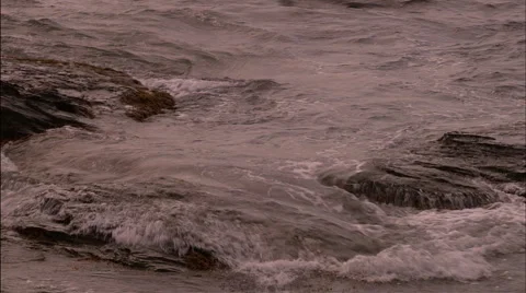 Ocean waves against rocks Stock Footage 53336003