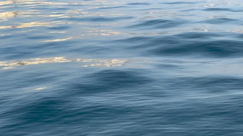 Ocean waves and buildings reflections filmed near a  port Stock Footage 164619548