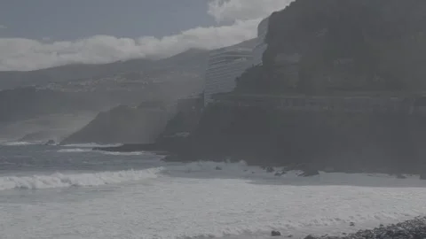 Ocean with waves  and city on mountain in background slog3 Stock-Footage 328255706