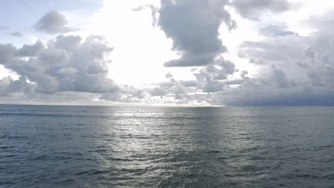 Ocean waves and Cloluds next to Bali Island 4K Drone shot Stock Footage 119334981