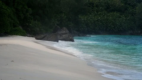 Ocean waves and granite rocks - Anse Intendance, Mahe Island, Seychelles. Stock Footage 128229518