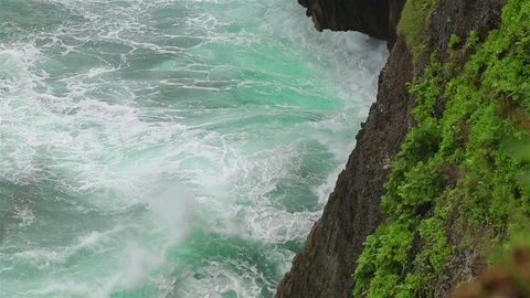 Ocean waves and a high cliff Stock Footage 72446015