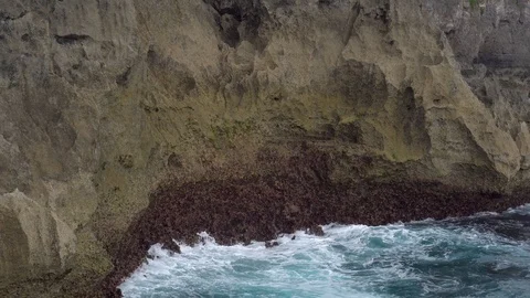 Ocean waves and high cliff on Nusa Penia island, Indonesia Stock Footage 86874414