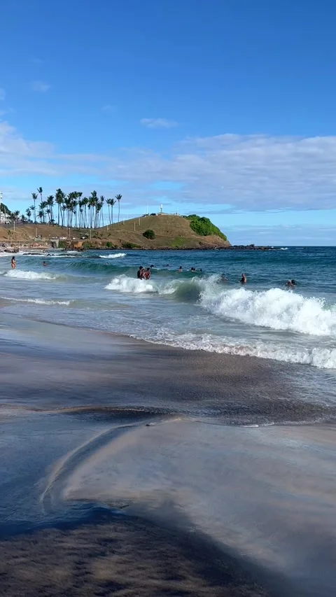 Ocean Waves and People Bathing near Morro do Cristo Beach Salvador Brazil Stock Footage 343779952