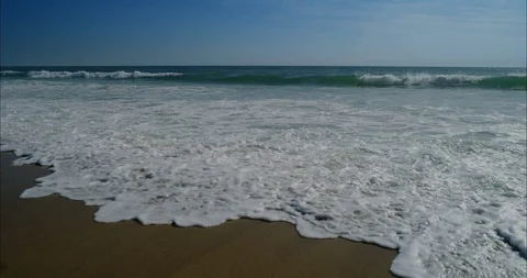 Ocean waves and sand 8k Stock Footage 113673903