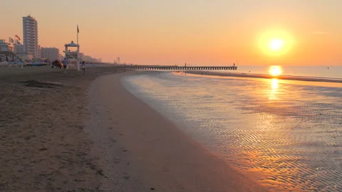 Ocean Waves and Sand in Soft Morning Light at Sunrise at the Beach Jesolo Italy Stock Footage 242301722