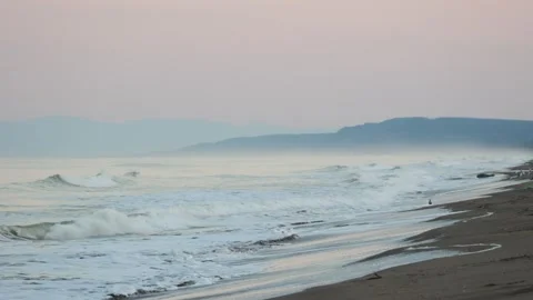 Ocean waves and sandy beach at dawn twilight Stock Footage 310841909