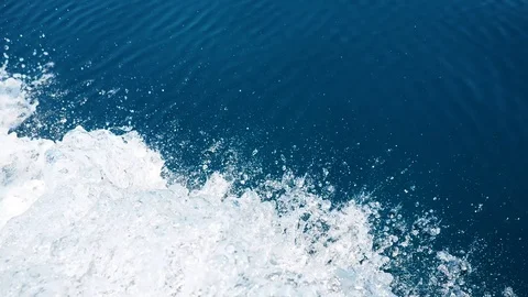 Ocean waves and splash from the side of a traveling cruise ship Video stock 125365614