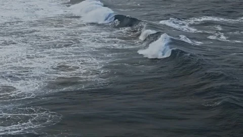 Ocean Waves and White Sea Foam Rolling Across Deep Blue Water Vídeo Stock 347635388