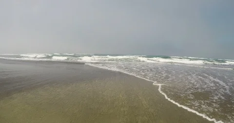 Ocean Waves Approaching Over Sandy Beach Stock Footage 97836223